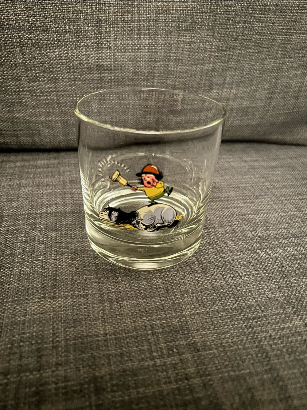Vintage highball glass showing a little boy ringing a bell to wake a horse
